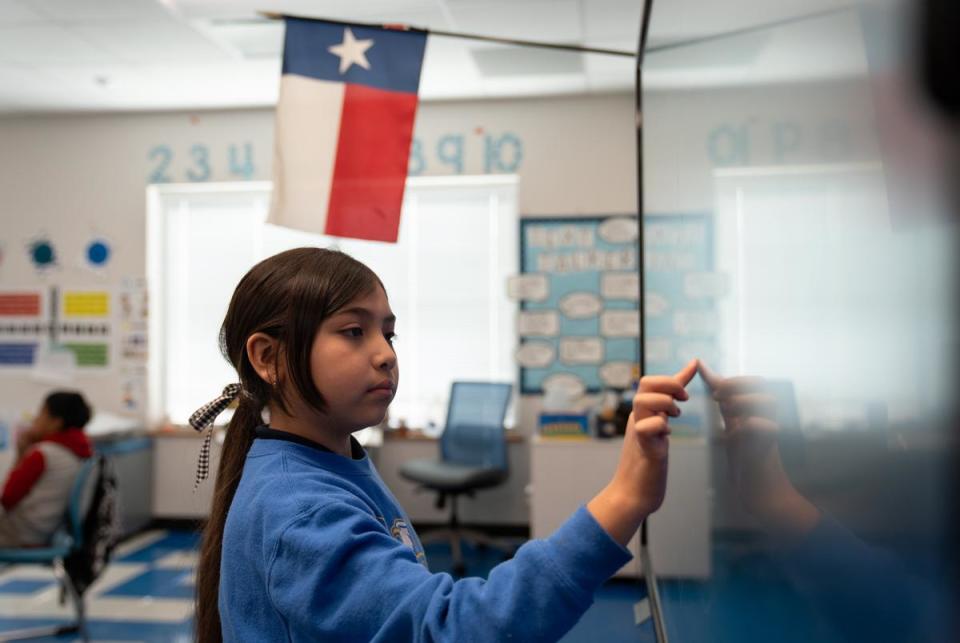 Third grade student Alaiyah B. demonstrates how she got her answer to Eran McGowan's class at the Eddie Bernice Johnson STEM Academy in Dallas, Texas on Feb. 5, 2024.