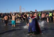 <p>Participants are seen in the water during a polar bear plunge at the beach in Coney Island, Brooklyn on Jan. 1, 2018. New Yorkers took part in new year’s day swim with temperature standing at -7 degrees Celsius. (Photo: Atilgan Ozdil/Anadolu Agency/Getty Images) </p>