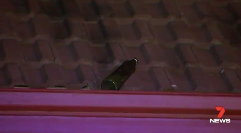 Another bottle landed on the roof of the house. Source: 7 News