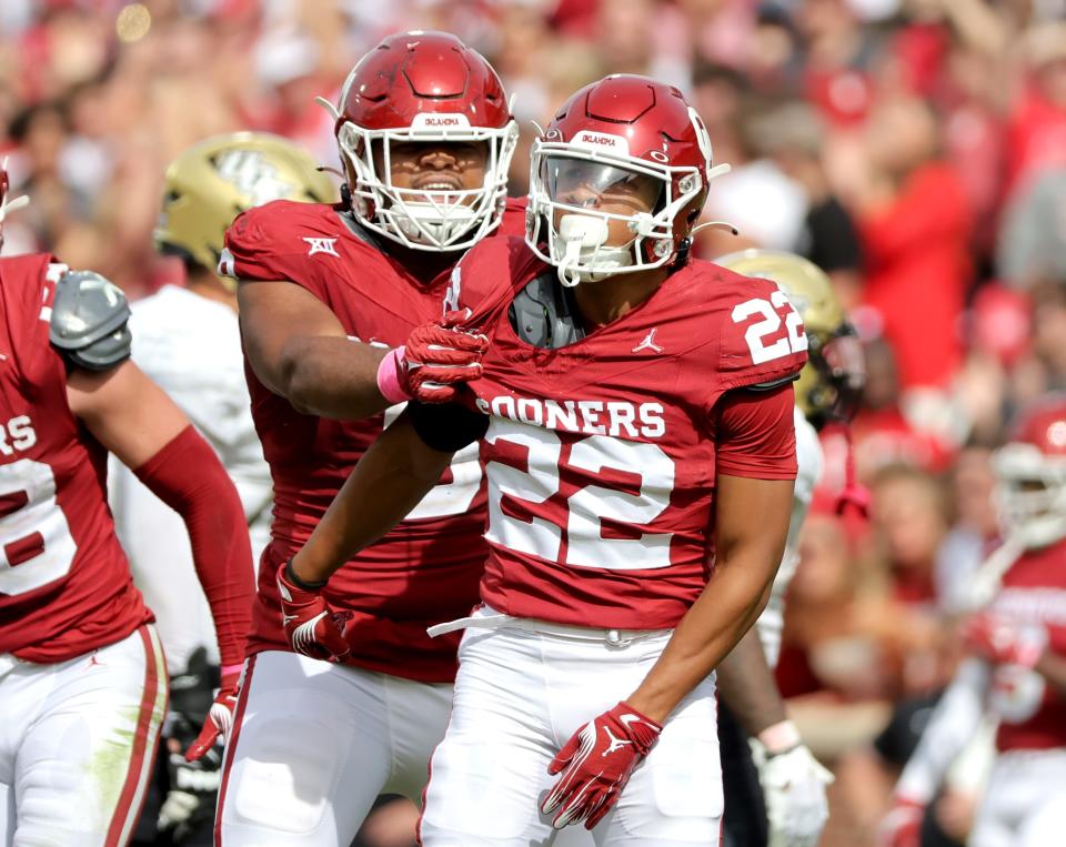 Oklahoma's Peyton Bowen (22) and Kalib Hicks (0) celebrate a play in the second half of the college football game between the University of Oklahoma Sooners and the University of Central Florida Knights at Gaylord Family Oklahoma-Memorial Stadium in Norman, Okla., Saturday, Oct., 21, 2023.