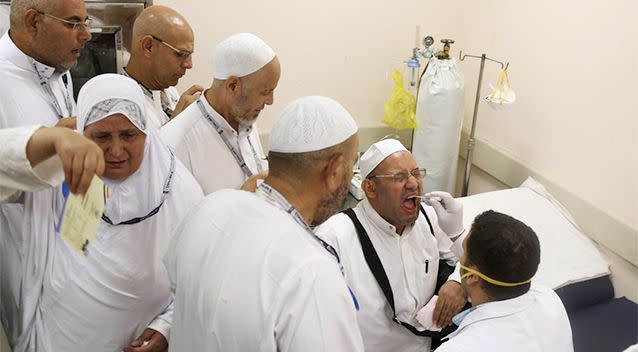 Health workers check passengers returning from haj pilgrimage in Saudi Arabia, at Cairo Airport. Photo: REUTERS/Asmaa Waguih