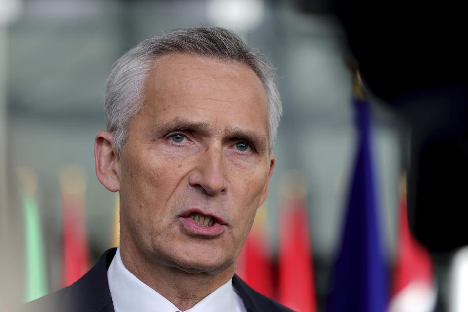 NATO Secretary General Jens Stoltenberg answers to reporters as he arrives for a meeting of NATO defense ministers at NATO headquarters in Brussels, Wednesday, Oct. 12, 2022. (AP Photo/Olivier Matthys)
