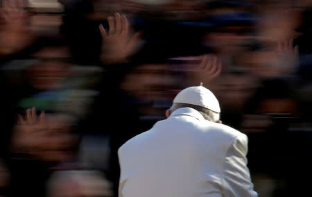 FILE PHOTO : Pope Francis waves as he arrives to lead the Wednesday general audience in Saint Peter's square at the Vatican November 22, 2017. REUTERS/Max Rossi/File Photo