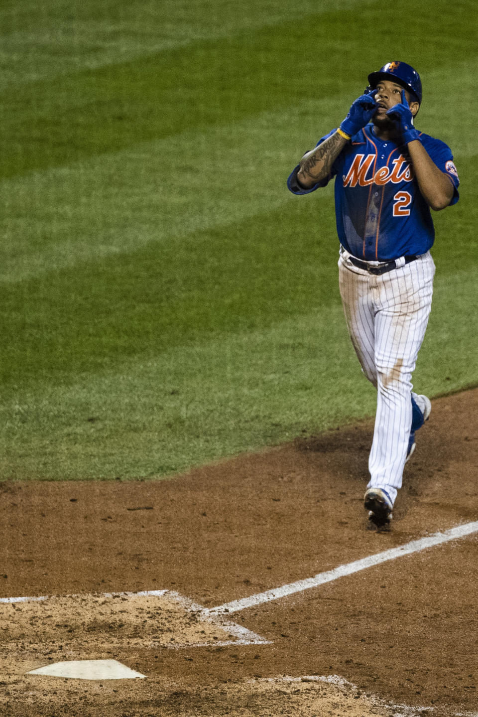 New York Mets' Dominic Smith (2) celebrates as he approaches home plate after hitting a home run during the sixth inningof a baseball game against the Washington Nationals Wednesday, Aug. 12, 2020, in New York. (AP Photo/Frank Franklin II)