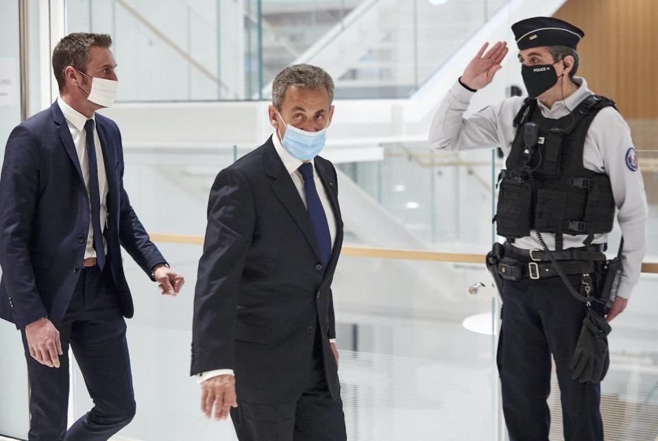 Sarkozy leaves court after being found guilty of corruption and influence peddling in 2021. <a href="https://www.gettyimages.com/detail/news-photo/former-french-president-nicolas-sarkozy-leaves-court-after-news-photo/1304713844?adppopup=true" rel="nofollow noopener" target="_blank" data-ylk="slk:Kiran Ridley/Getty Images;elm:context_link;itc:0;sec:content-canvas" class="link ">Kiran Ridley/Getty Images</a>