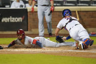 St. Louis Cardinals' Edmundo Sosa slides past New York Mets catcher James McCann to score on a Harrison Bader two-run single during the first inning of a baseball game Wednesday, Sept. 15, 2021, in New York. (AP Photo/Frank Franklin II)