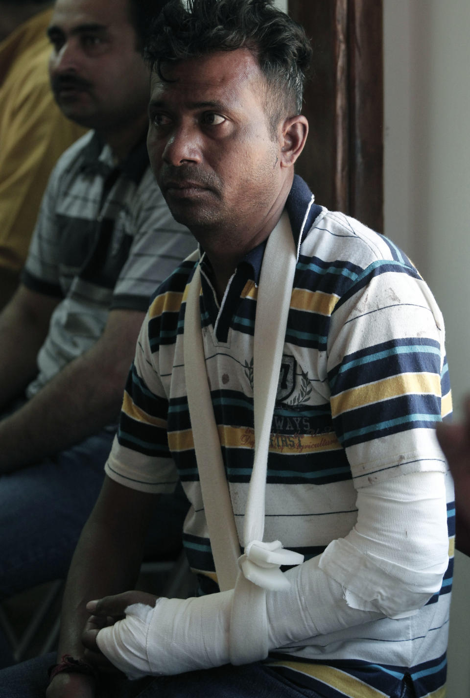 Indian migrant worker Nermal Chand, who was attacked at his home by masked men near Athens, attends a news conference organized by anti-racism campaigners in Athens, Thursday, July 19, 2012. Human rights groups say racially motivated attacks have soared in Greece in recent months. The extreme right Golden Dawn party won 18 seats in parliament in elections last month. It denies direct involvement in the attacks. (AP Photo/Dimitri Messinis)