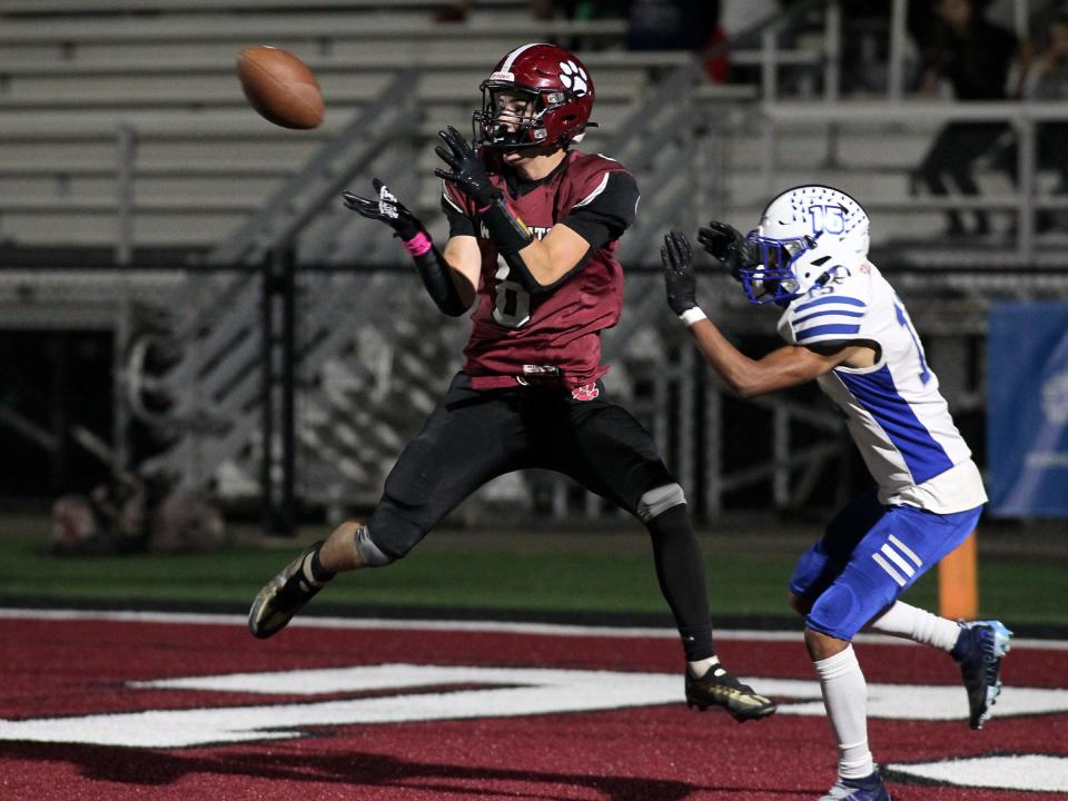 Newark's Preston Lunsford catches a pass for a two-point conversion after catching a previous pass for a touchdown against Central Crossing on Friday.