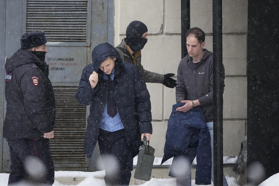 Wall Street Journal reporter Evan Gershkovich, right, is escorted from the Lefortovsky court in Moscow, Russia, Friday, Jan. 26, 2024. Evan Gershkovich, a Wall Street Journal reporter who was detained on espionage charges, lost an appeal Friday against his arrest, meaning he will stay in jail until the end of March, Russian state news agencies reported. The hearing took place behind closed doors because authorities say details of the criminal case against the American journalist are classified. (AP Photo/Alexander Zemlianichenko)