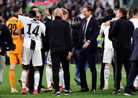 Soccer Football - Serie A - Juventus v Fiorentina - Allianz Stadium, Turin, Italy - April 20, 2019 Juventus coach Massimiliano Allegri celebrates winning the league after the match with Blaise Matuidi and team mates REUTERS/Massimo Pinca