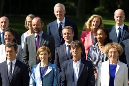 French President Emmanuel Macron, Prime Minister Edouard Philippe and ministers pose for a family photo in the gardens of the Elysee Palace before the weekly cabinet meeting in Paris, France, June 22, 2017. REUTERS/Charles Platiau