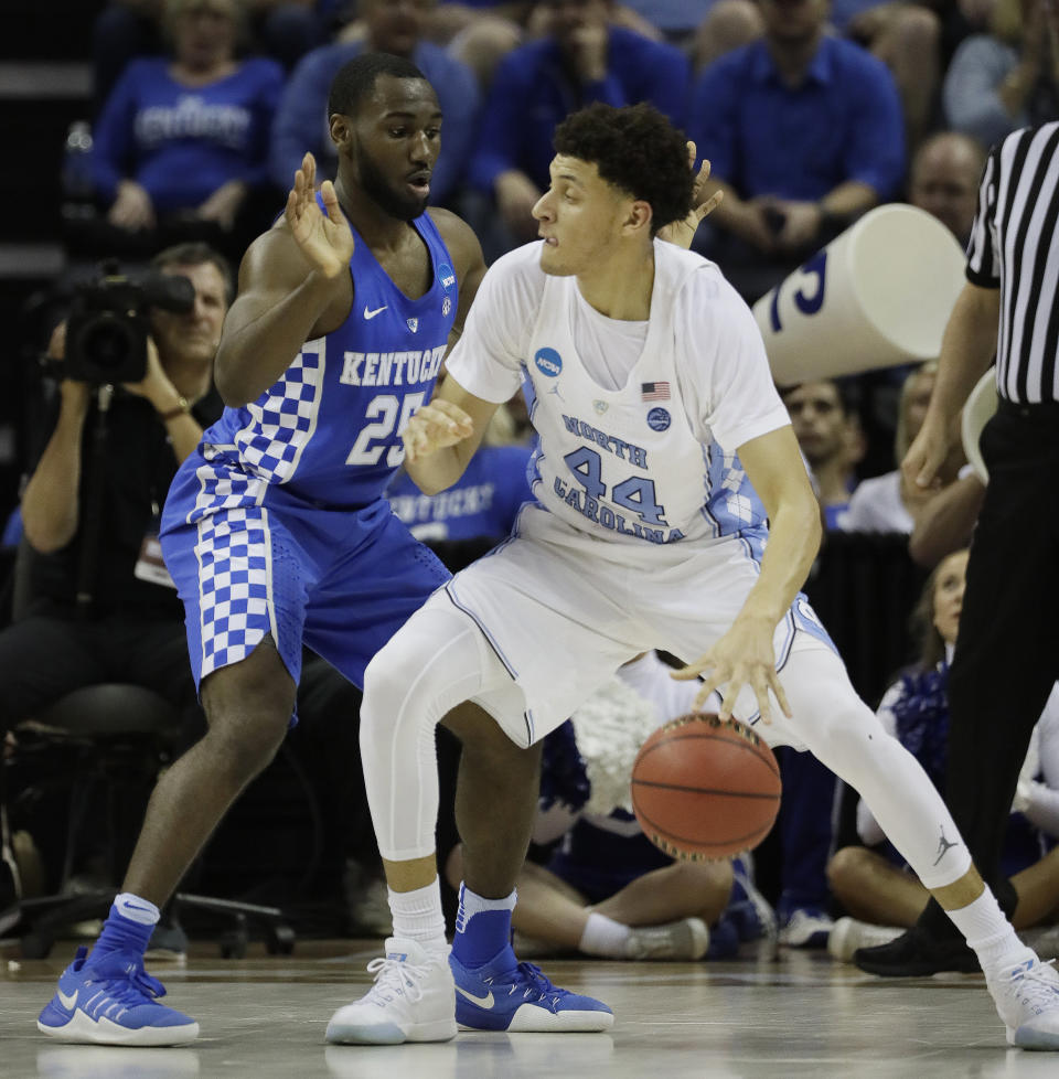 North Carolina forward Justin Jackson (44) drives on Kentucky guard Dominique Hawkins (25) in the first half of the South Regional final game in the NCAA college basketball tournament Sunday, March 26, 2017, in Memphis, Tenn. (AP Photo/Mark Humphrey)