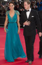 <p>Kate stunned in an emerald chiffon Jenny Packham gown with a lace back for a gala dinner. She carried a matching clutch and finished with glittering Jimmy Choo sandals. </p><p><i>[Photo: PA]</i></p>