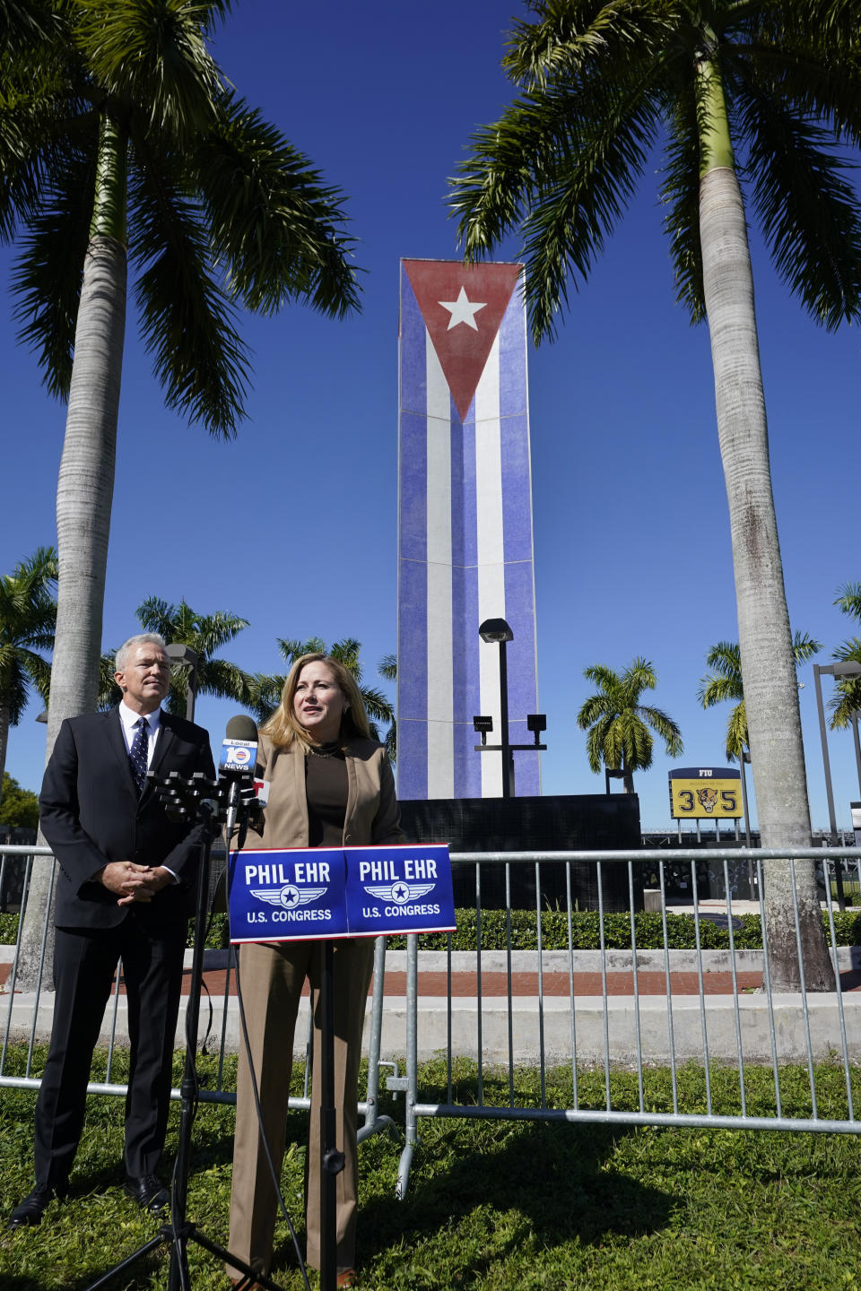 Former Rep. Debbie Mucarsel-Powell, D-Fla., right, speaks alongside Navy Cmdr. (Ret.) Phil Ehr, during a news conference at the Memorial Cubano in Tamiami Park, Wednesday, Oct. 18, 2023, in Miami. Mucarsel-Powell, who is running for a Senate seat against Republican Rick Scott, endorsed Ehr for Congress. (AP Photo/Wilfredo Lee)