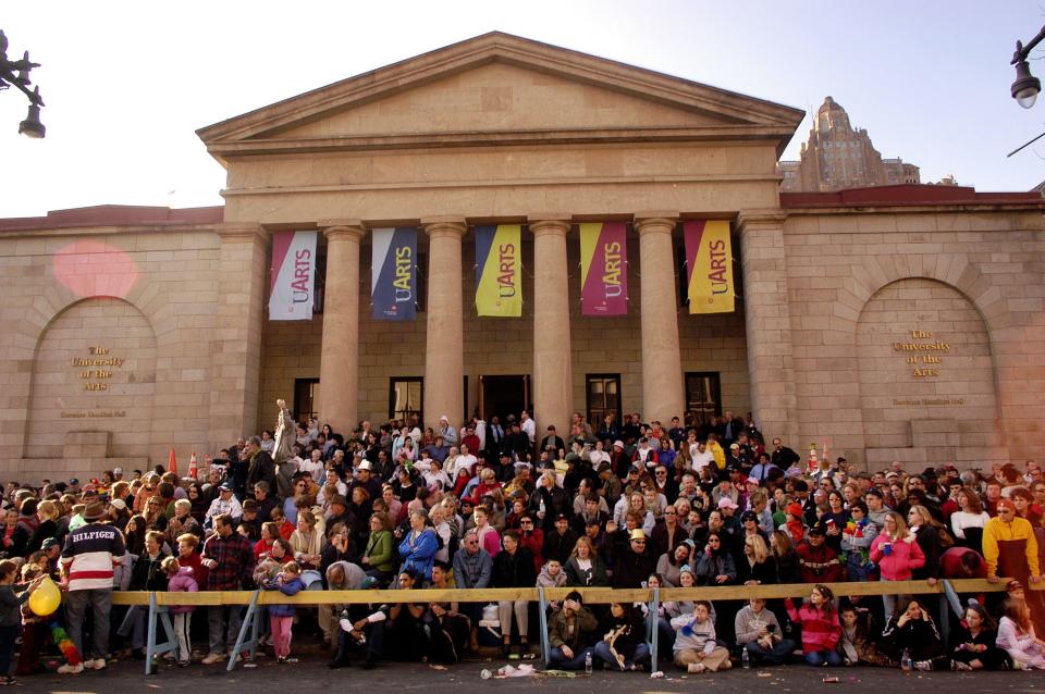 An overflow crowd sits on the steps of the University of the Arts watching the Philadelphia Mummers Parade January 1, 2005 in Philadelphia, Pennsylvania.