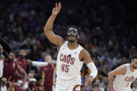 Cleveland Cavaliers guard Donovan Mitchell (45) gestures after hitting a 3-point shot against the Phoenix Suns during the first half of an NBA basketball game in Phoenix, Wednesday, April. 3, 2024. (AP Photo/Darryl Webb)