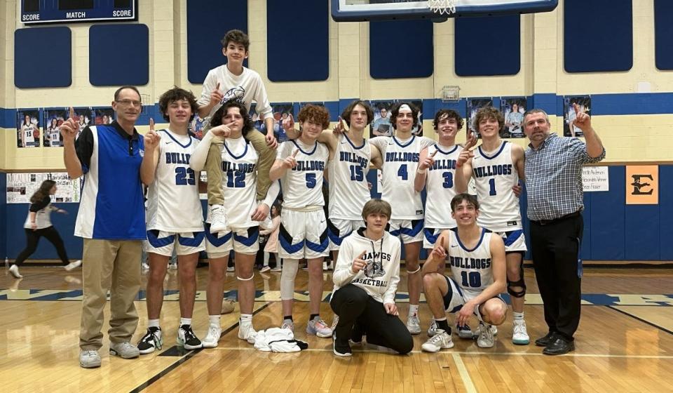 The Inland Lakes Bulldogs captured a share of their first Ski Valley Conference boys basketball title since 2005 after beating Gaylord St. Mary at home on Tuesday.