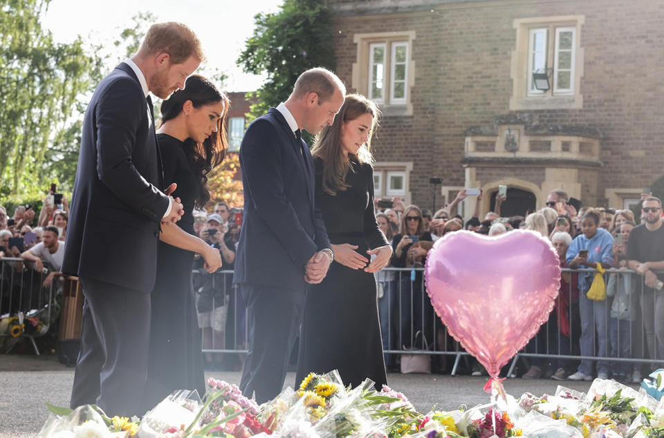 Harry, Meghan, William and Kate look at flowers