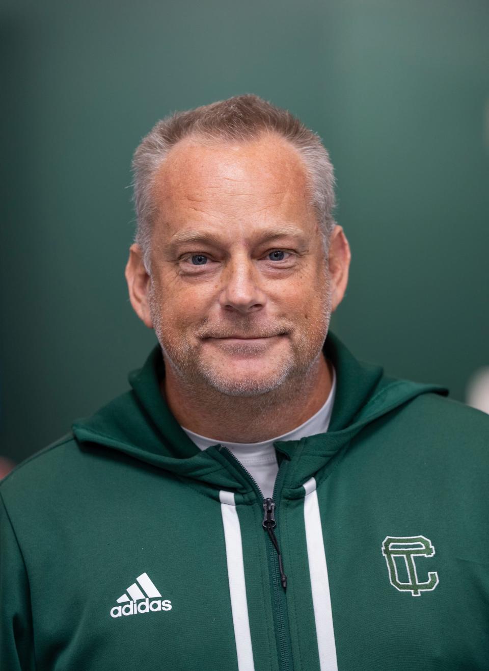 Cass Tech varsity golf head coach Martin Siml poses for a photo while meeting with members of the press at the Royal Oak Golf Center in Royal Oak on Tuesday, October 17, 2023, before their Division 1 State Championship Tournament this weekend. Cass Tech is the first girl's team from Detroit to reach that level and the team is only three years old.
