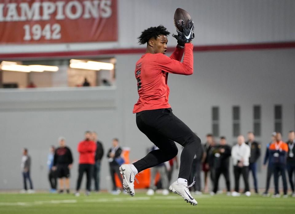 Former Ohio State Buckeyes wide receiver Garrett Wilson catches a pass during the football pro day at the Woody Hayes Athletic Center in Columbus, Ohio, on March 23, 2022.