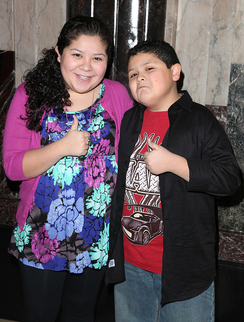 Raini and Rico on a red carpet as kids