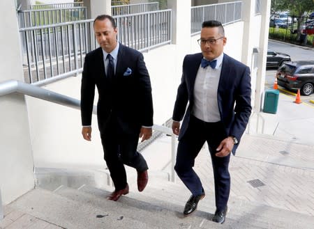 Attorneys Joseph DiRuzzo and David Sobel walk to the Broward County Jail in Fort Lauderdale, Florida