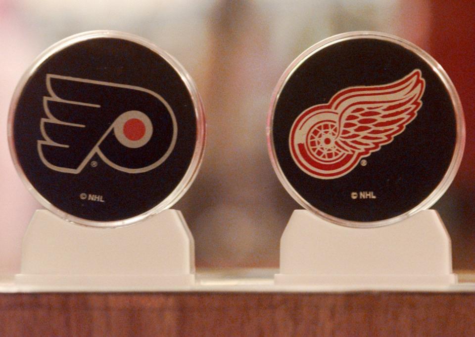 These official souvenir pucks cost $4.95 and the holders cost $3.95 at the Hilton Hotel at the NHL headquarters is in Philadelphia, May 31, 1997, at the start of the Stanley Cup Final.