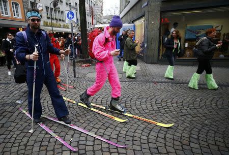 Carnival revellers celebrate during "Weiberfastnacht" (Women's Carnival) in Cologne, Germany February 23, 2017, marking the start of a week of street festivals with the highlight "Rosenmontag", Rose Monday processions. REUTERS/Wolfgang Rattay