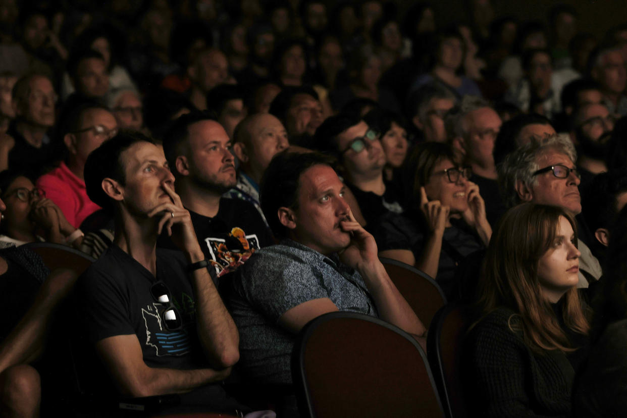 Moviegoers watch a showing of the film 