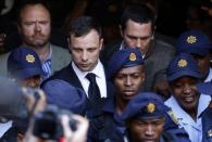 South African Olympic and Paralympic sprinter Oscar Pistorius leaves the North Gauteng High Court in Pretoria, September 12, 2014. REUTERS/Mike Hutchings