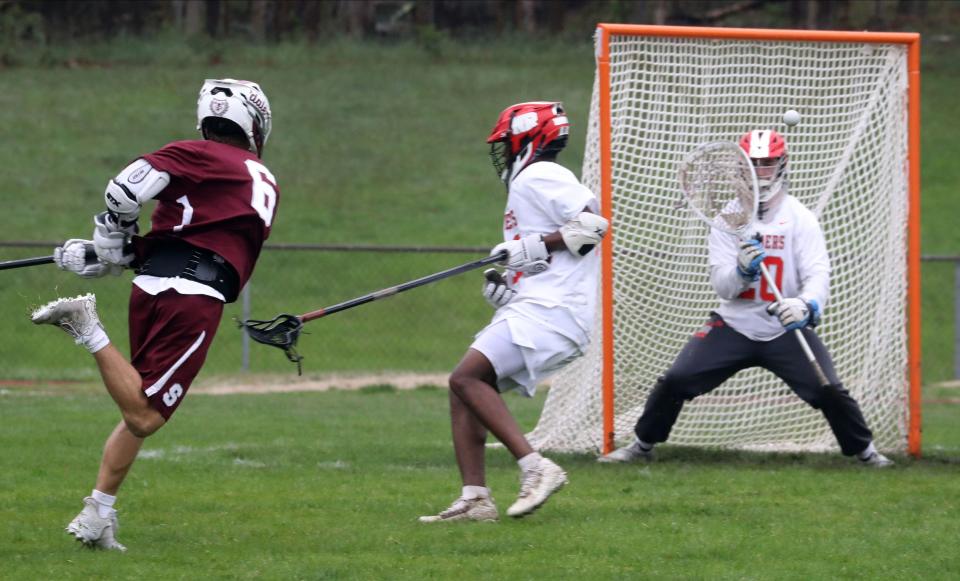 Jake Goldstein of Scarsdale shoots on North Rockland goalie Kevin Devine during a varsity lacrosse game at North Rockland High School May 2, 2022. Scarsdale defeated North Rockland 15-5.