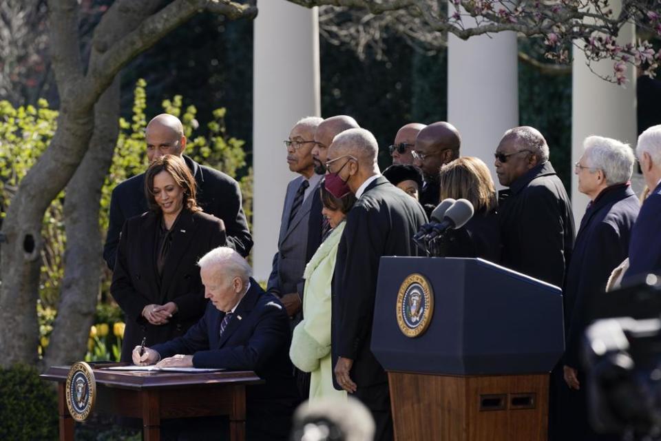 President Joe Biden signs the Emmett Till Anti-Lynching Act in the Rose Garden of the White House on Tuesday in Washington.