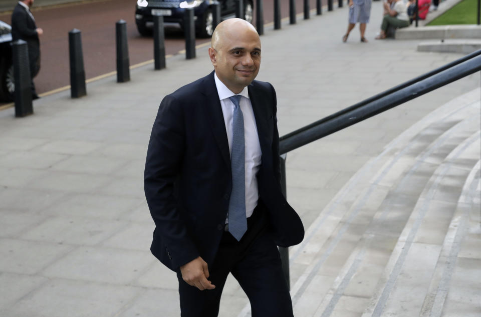 Britain's new Chancellor Sajid Javid arrives at the treasury in London, Wednesday, July 24, 2019. British Prime Minister Boris Johnson has appointed Sajid Javid the country's new Treasury chief, one of the most senior jobs in Cabinet. Javid will be responsible for spending and economic policy in Johnson's government. (AP Photo/Matt Dunham)