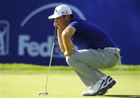 Jan 25, 2014; La Jolla, CA, USA; Gary Woodland lines up his putt on the nineteenth hole during the third round of the Farmers Insurance Open golf tournament at Torrey Pines Municipal Golf Course - South Co. Mandatory Credit: Christopher Hanewinckel-USA TODAY Sports