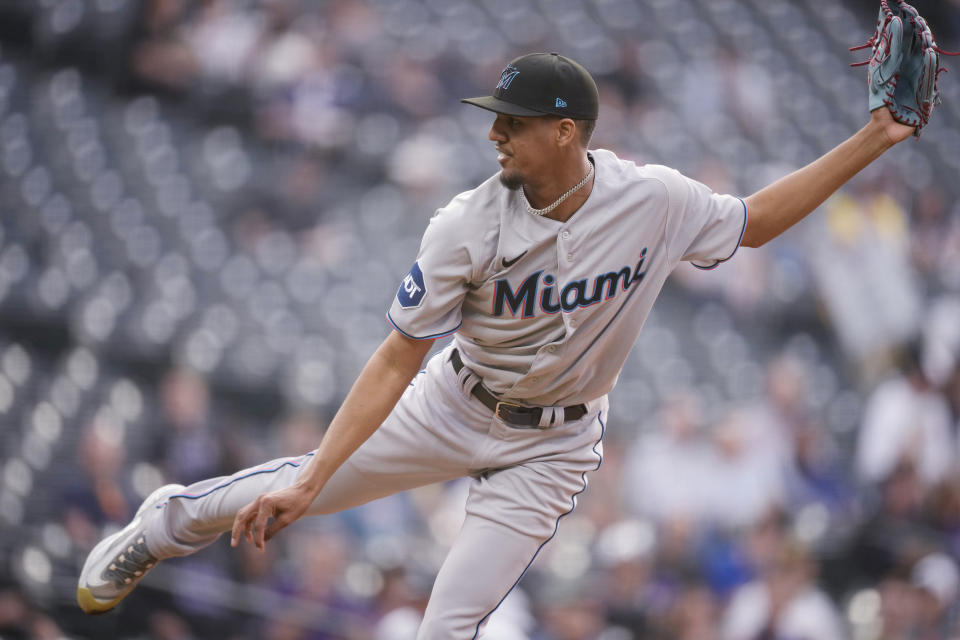 Miami Marlins starting pitcher Eury Perez watches a throw to a Colorado Rockies batter during the first inning of a baseball game Tuesday, May 23, 2023, in Denver. (AP Photo/David Zalubowski)