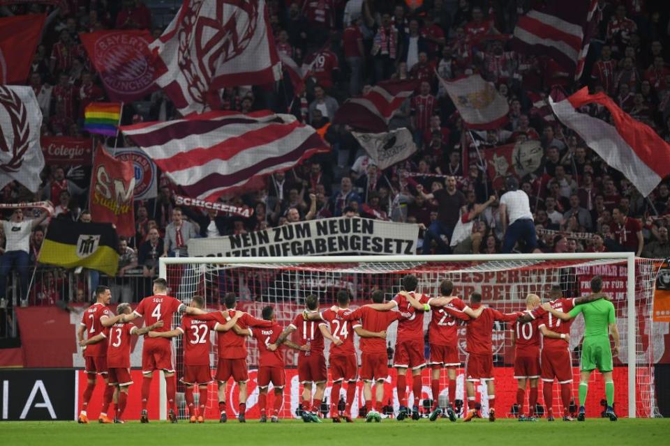 Bayern Munich embrace their home supporters after they progressed to the semi-finals.