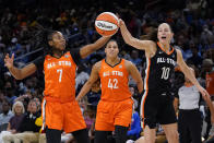 Team Stewart's Ariel Atkins, left, and Team Wilson's Sue Bird battle for a loose ball during the first half of a WNBA All-Star basketball game in Chicago, Sunday, July 10, 2022. (AP Photo/Nam Y. Huh)