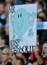 Manchester City fans hold up a placard as they play against Manchester United during their English Premier League football match at The Etihad stadium in Manchester, north-west England on April 30, 2012. AFP PHOTO/PAUL ELLIS RESTRICTED TO EDITORIAL USE. No use with unauthorized audio, video, data, fixture lists, club/league logos or “live” services. Online in-match use limited to 45 images, no video emulation. No use in betting, games or single club/league/player publications.PAUL ELLIS/AFP/GettyImages