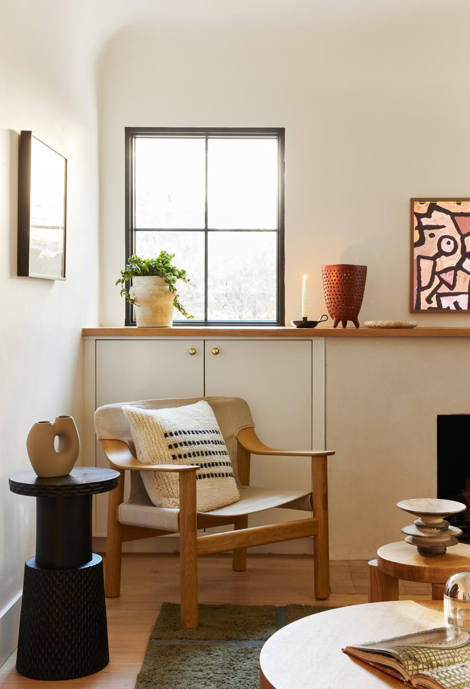 A Bernard lounge chair by Hay sits in the company of Place’s hand-carved Congo table. The pillow is the Lorenzo by Morrow Goods.