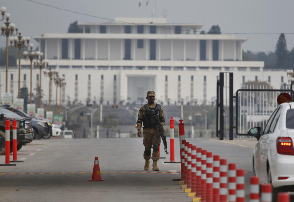 A Pakistani army soldier patrols at a checkpoint near presidency to ensure security ahead of Saudi Arabia's crown prince visit to Pakistan, in Islamabad, Pakistan, Sunday, Feb. 17, 2019. Saudi Crown Prince Mohammed bin Salman will arrive in Islamabad on Sunday evening on an official visit that is expected to include the signing of agreements for billions of dollars of investment in Pakistan. (AP Photo/Anjum Naveed)