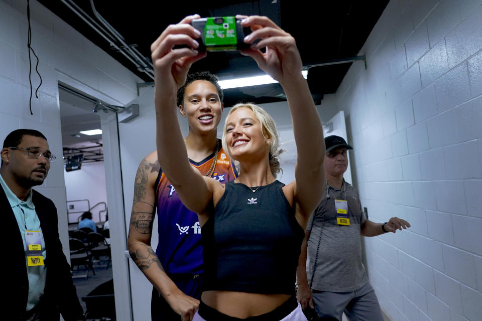 Phoenix Mercury guard Sophie Cunningham takes a selfie with teammate Brittney Griner, during the WNBA basketball teams' media day, in Phoenix, Wednesday, May 3, 2023. (AP Photo/Matt York)