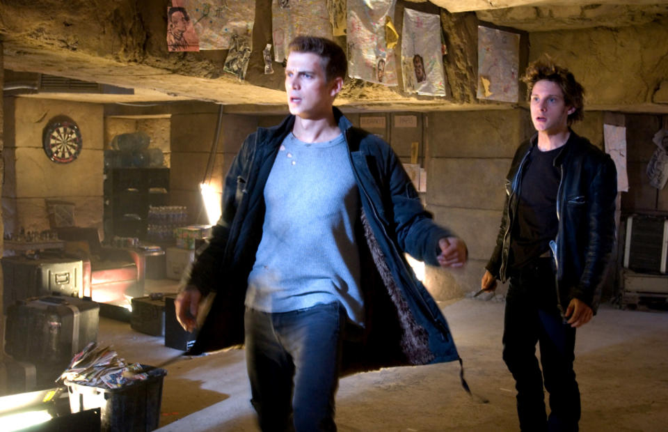 Hayden Christensen, Jamie Bell running towards something in an old pyramid