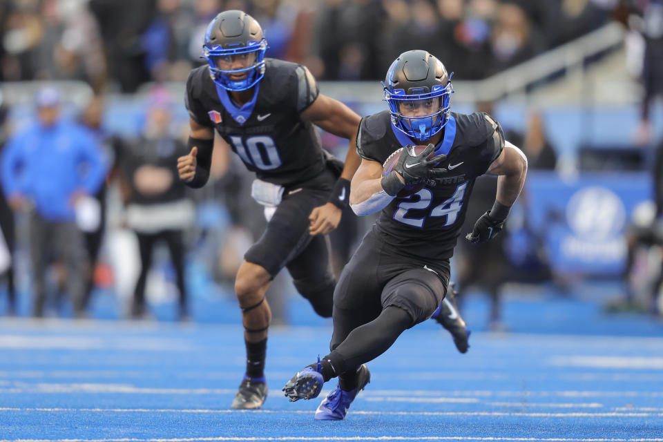 Boise State running back George Holani (24) runs with the ball against BYU in the first half of an NCAA college football game, Saturday, Nov. 5, 2022, in Boise, Idaho. (AP Photo/Steve Conner)