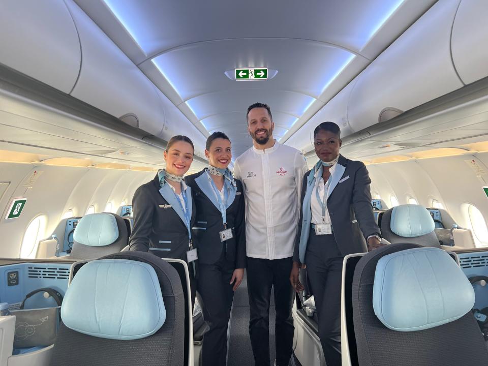 Flying on La Compagnie all-business class airline from Paris to New York — chef Franco Sampogna with the flight attendants.