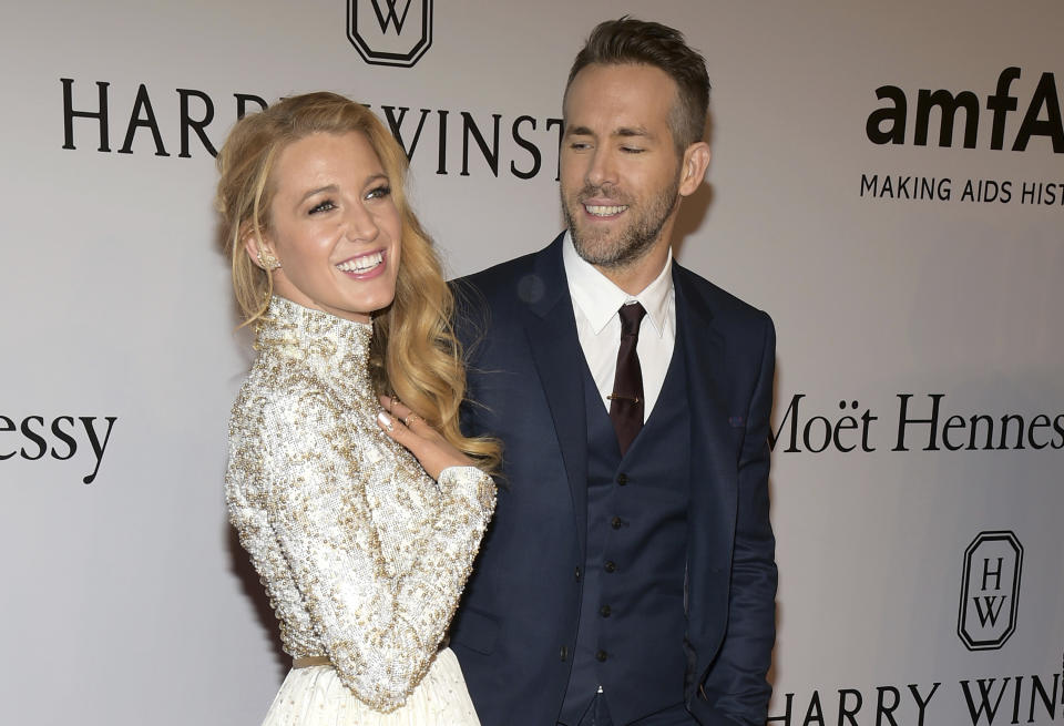 FILE - In this Feb. 10, 2016, file photo, Blake Lively, left, and Ryan Reynolds attend amfAR's New York Gala honoring Harvey Weinstein at Cipriani Wall Street in New York. Reynolds revealed on TBS' "Conan" Nov. 3, 2016, that his new baby with Lively is a girl. (Photo by Charles Sykes/Invision/AP, File)