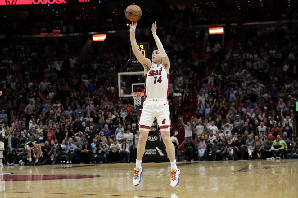 Miami Heat guard Tyler Herro (14) shoots a 3-pointer during overtime in an NBA basketball game against the Chicago Bulls, Sunday, Dec. 8, 2019, in Miami. The Heat won 110-105 in overtime. (AP Photo/Lynne Sladky)