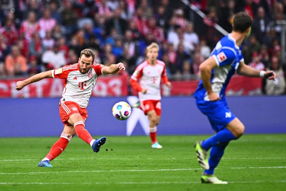 Kane scores from his own half in one of his three Bundesliga hat-tricks (AP)