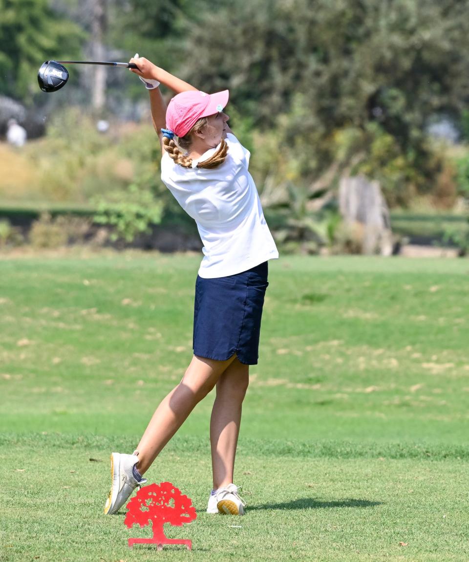 Redwood's Audrey Williams tees off Thursday, September 21, 2023 in the East Yosemite League high school girls golf 18-hole mini match at Valley Oaks Golf Course.