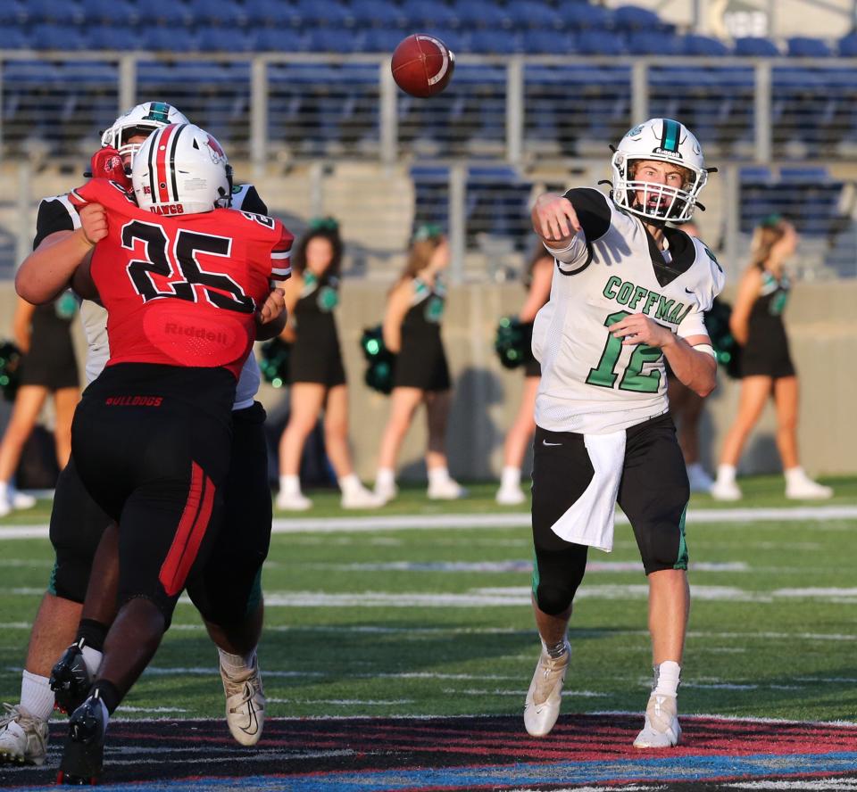 Quinn Hart, 12, of Dublin Coffman targets a receiver while being presssured by Braylon Minor, 25, of McKinley during their game at McKinley on Friday, Sept. 2, 2022.