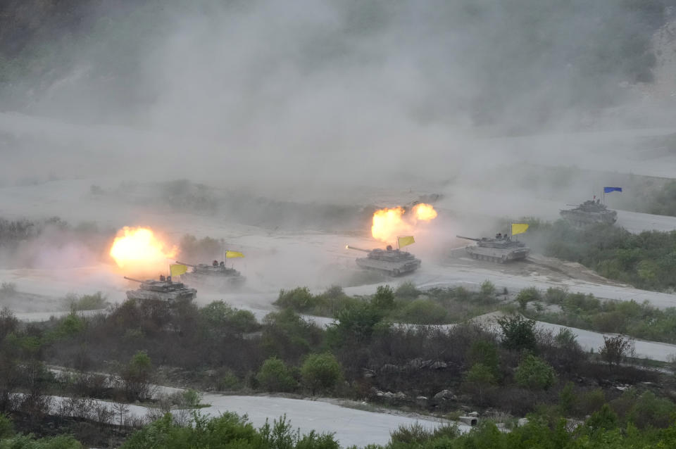 FILE - South Korean army's K-2 tanks fire during a South Korea-U.S. joint military drills at Seungjin Fire Training Field in Pocheon, South Korea, Thursday, May 25, 2023. North Korea on Tuesday, May 30, confirmed plans to launch its first military spy satellite in June and described such capacities as crucial for monitoring the United States' "reckless" military exercises with rival South Korea. (AP Photo/Ahn Young-joon, File)